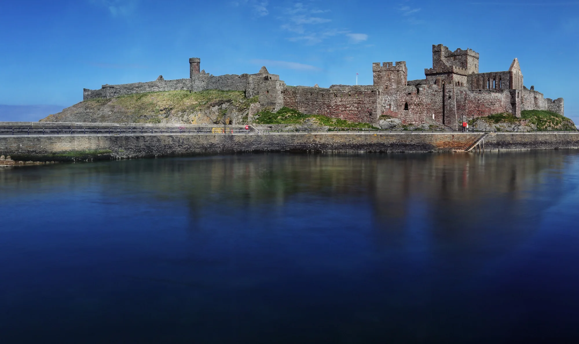 Peel Castle reflected in the water on St Patrick’s Isle