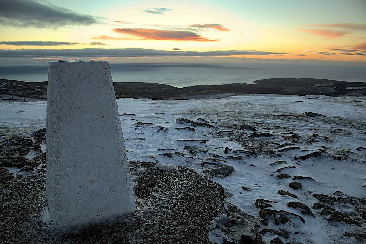 Snow at the summit of Snaefell at sunrise